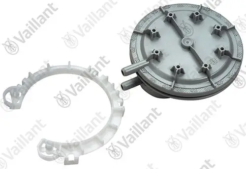Vaillant Druckwächter mit einer runden grauen Komponente und einem weißen Ring, der zur Montage oder Verbindung dient. Zwei Rohre sind an der grauen Komponente angebracht.